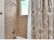 Simple bathroom with shower and tiled walls at 3737 S Atlantic Ave # 204, Daytona Beach Shores, FL 32118