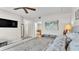 Spacious bedroom with large TV, sitting area, and ensuite bathroom at 3737 S Atlantic Ave # 204, Daytona Beach Shores, FL 32118