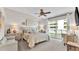Primary bedroom with king-size bed and access to balcony at 3737 S Atlantic Ave # 204, Daytona Beach Shores, FL 32118
