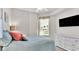 Guest bedroom with dresser, comfortable bed, and window with view at 3737 S Atlantic Ave # 204, Daytona Beach Shores, FL 32118