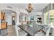 Open dining area with chandelier and seating for four at 3737 S Atlantic Ave # 204, Daytona Beach Shores, FL 32118