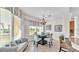 Bright dining area with a table for four and large windows at 3737 S Atlantic Ave # 204, Daytona Beach Shores, FL 32118