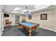 Relaxing game room with a pool table and bookcase at 3737 S Atlantic Ave # 204, Daytona Beach Shores, FL 32118