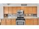 Kitchen boasts granite countertops and stainless steel appliances at 3737 S Atlantic Ave # 204, Daytona Beach Shores, FL 32118