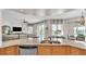 Open kitchen with granite island, stainless steel appliances, and ocean views at 3737 S Atlantic Ave # 204, Daytona Beach Shores, FL 32118