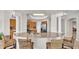 Kitchen island with granite countertop and seating for four at 3737 S Atlantic Ave # 204, Daytona Beach Shores, FL 32118