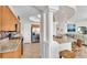 Kitchen with granite countertops, stainless steel appliances, and light wood cabinets at 3737 S Atlantic Ave # 204, Daytona Beach Shores, FL 32118