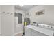 Laundry room with washer, dryer, and hot water heater at 3737 S Atlantic Ave # 204, Daytona Beach Shores, FL 32118