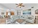 Open living space with sectional sofa, coffee table, and kitchen views at 3737 S Atlantic Ave # 204, Daytona Beach Shores, FL 32118