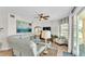 Spacious living room featuring light-colored furniture and large artwork at 3737 S Atlantic Ave # 204, Daytona Beach Shores, FL 32118