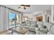 Living room with sectional sofa and access to balcony with ocean view at 3737 S Atlantic Ave # 204, Daytona Beach Shores, FL 32118