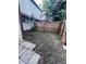 Small backyard with patchy grass and wooden fence at 3992 Crayrich Cir # C3, Orlando, FL 32839