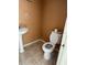 Small half bathroom with pedestal sink and toilet at 3992 Crayrich Cir # C3, Orlando, FL 32839