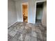Bedroom with tiled floors and access to bathroom and closet at 3992 Crayrich Cir # C3, Orlando, FL 32839