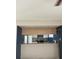 Kitchen with white cabinets and a breakfast bar at 3992 Crayrich Cir # C3, Orlando, FL 32839