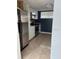Bright kitchen features stainless steel appliances and white cabinetry at 3992 Crayrich Cir # C3, Orlando, FL 32839