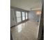 Bright living room with tile flooring and multiple windows at 3992 Crayrich Cir # C3, Orlando, FL 32839