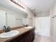 Double vanity bathroom with tub and shower at 16962 Sw 40Th Cir, Ocala, FL 34473
