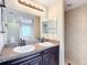 Double vanity bathroom with walk-in shower at 16962 Sw 40Th Cir, Ocala, FL 34473