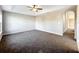 Empty carpeted bedroom with ceiling fan at 16962 Sw 40Th Cir, Ocala, FL 34473