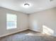 Well-lit bedroom with carpet and window at 16962 Sw 40Th Cir, Ocala, FL 34473