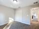 Bright bedroom with double doors and carpet flooring at 16962 Sw 40Th Cir, Ocala, FL 34473