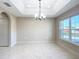 Bright dining room features tile flooring and a chandelier at 16962 Sw 40Th Cir, Ocala, FL 34473