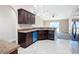 Kitchen with dark wood cabinets and stainless steel appliances at 16962 Sw 40Th Cir, Ocala, FL 34473