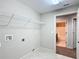 Laundry room with additional bathroom access and shelving at 16962 Sw 40Th Cir, Ocala, FL 34473