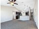 Spacious living room with an open floor plan and neutral carpeting at 16962 Sw 40Th Cir, Ocala, FL 34473