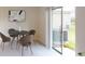 Dining area with table and chairs, and sliding glass door to patio at 673 Bell Prairie Cir, Lake Wales, FL 33859