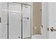 Shower stall with glass enclosure and neutral tile at 8989 Cabot Cliffs Dr, Davenport, FL 33896