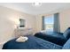 Two twin beds in a bright bedroom with light walls at 8989 Cabot Cliffs Dr, Davenport, FL 33896