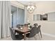 Dining room with a wooden table and gray chairs at 8989 Cabot Cliffs Dr, Davenport, FL 33896