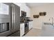 Modern kitchen with stainless steel appliances and white cabinetry at 8989 Cabot Cliffs Dr, Davenport, FL 33896