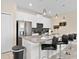 Modern kitchen with gray countertops and stainless steel appliances at 8989 Cabot Cliffs Dr, Davenport, FL 33896