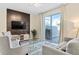 Living room with sliding doors leading to a pool area at 8989 Cabot Cliffs Dr, Davenport, FL 33896