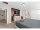 Main bedroom with king bed, dresser, and a large TV at 8989 Cabot Cliffs Dr, Davenport, FL 33896