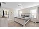 Spacious main bedroom with king-size bed and ensuite bathroom at 8989 Cabot Cliffs Dr, Davenport, FL 33896