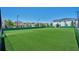 Community sports field with artificial turf at 8989 Cabot Cliffs Dr, Davenport, FL 33896