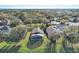 Aerial view of home and neighborhood with lake at 16741 Rising Star Dr, Clermont, FL 34714