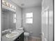 Bathroom with grey walls, vanity, and toilet at 16741 Rising Star Dr, Clermont, FL 34714