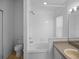 Clean bathroom with a bathtub, toilet and double vanity at 16741 Rising Star Dr, Clermont, FL 34714