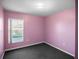 Pink bedroom with a window overlooking the lake at 16741 Rising Star Dr, Clermont, FL 34714