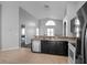Modern kitchen with stainless steel appliances and a breakfast bar at 16741 Rising Star Dr, Clermont, FL 34714