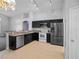 Kitchen with dark cabinets and stainless steel appliances at 16741 Rising Star Dr, Clermont, FL 34714