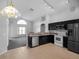 Open kitchen with stainless steel appliances and breakfast bar at 16741 Rising Star Dr, Clermont, FL 34714