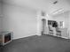 Living room with fireplace and kitchen view at 16741 Rising Star Dr, Clermont, FL 34714