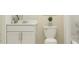 Clean bathroom with white vanity, toilet, and bathtub at 1717 Teagan Ln, Winter Haven, FL 33884