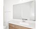 Bathroom featuring a vanity with modern fixtures and large mirror, perfect for a relaxing space at 4471 Sw 84Th Street Rd, Ocala, FL 34476